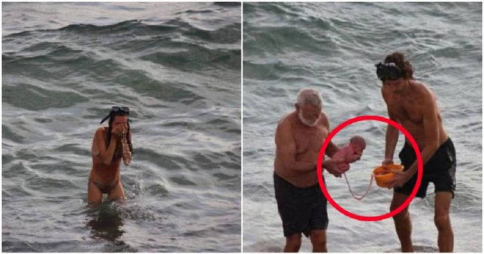 Pensaram que esta jovem estava nadando, mas então um bebê surgiu entre as ondas do Mar Vermelho