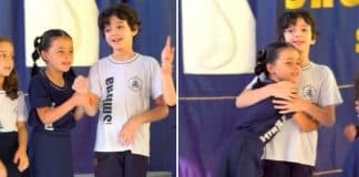 Menina de 8 anos ajuda amiguinho autista em apresentação da escola e viraliza na web